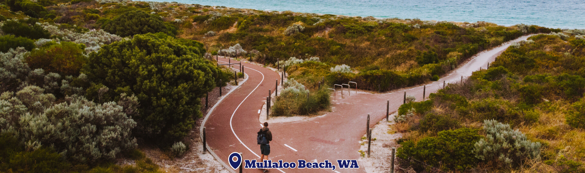 Pathway leading to a beach with 'Mullaloo Beach, WA' text overlay